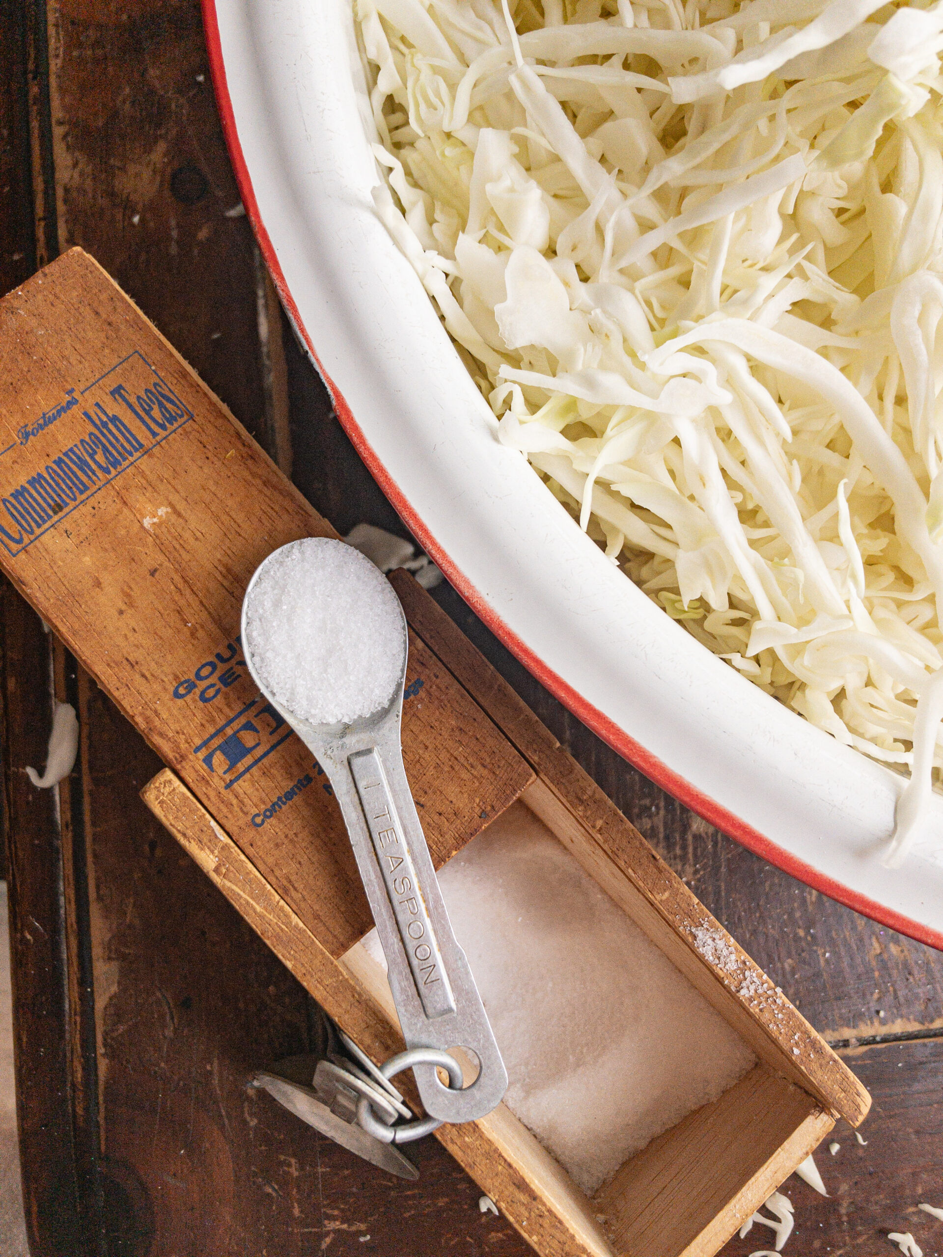 chopped cabbage and measured spoon of salt