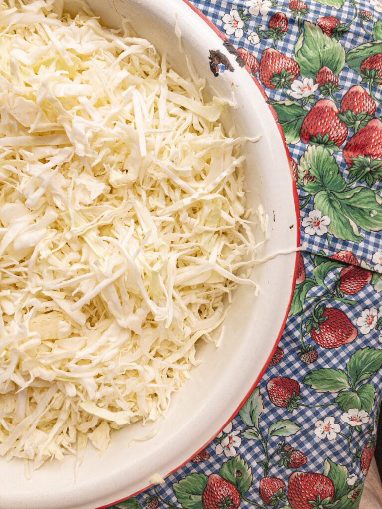 shredded cabbage in a white bowl
